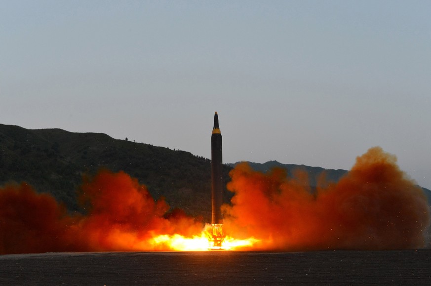 epa05965794 An undated photo released 15 May 2017 by North Korean Central News Agency (KCNA) showing the test-firing of a new ground-to-ground medium long-range strategic ballistic rocket Hwasong-12 o ...