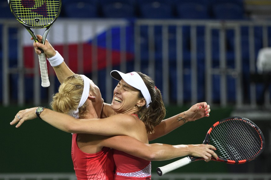 epa05479145 Timea Bacsinszky (L) and Martina Hingis (R) of Switzerland celebrate after winning the women&#039;s semi-final doubles match against Andrea Hlavackova and Lucie Hradecka from Czech Republi ...