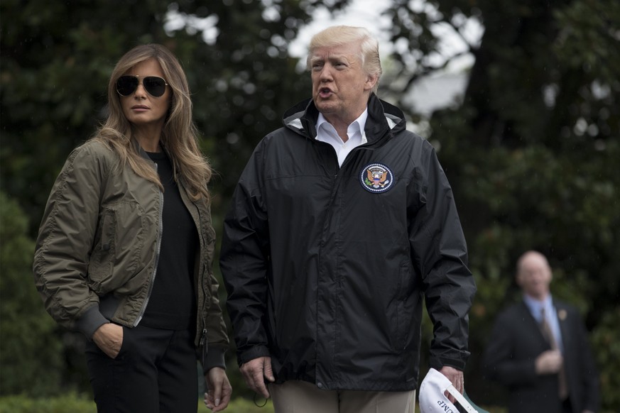 epa06170120 US President Donald J. Trump (R) and First Lady Melania Trump (L) walk out of the South Portico to depart the South Lawn of the White House by Marine One, in Washington, DC, USA, 29 August ...