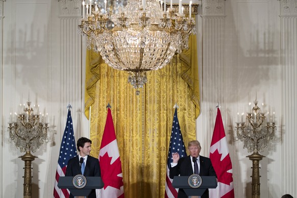 epa05791607 US President Donald J. Trump (R) and Canadian Prime Minister Justin Trudeau (L) participate in a joint press conference in the East Room of the White House in Washington, DC, USA, 13 Febru ...