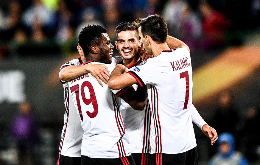 epa06204826 Milan&#039;s Andre Silva (C) celebrates with his teammates Franck Kessie (L) and Nikola Kalinic (R) after scoring the 4-1 lead during the UEFA Europa League Group D soccer match between FK ...