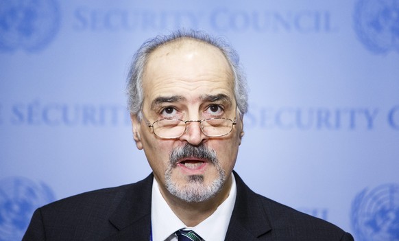 epa05682368 Ambassador Bashar Ja&#039;afari, Syria&#039;s Permanent Representative to the United Nations, talks with reporters after the United Nations Security Council voted to approve a resolution t ...