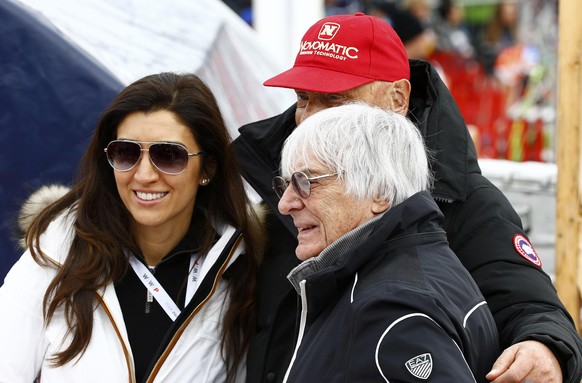 Formula One Chief Executive Bernie Ecclestone (R), his wife Fabiana Flosi and Former Formula One champion Niki Lauda pose for a picture during the men&#039;s Alpine Skiing World Cup downhill race in K ...