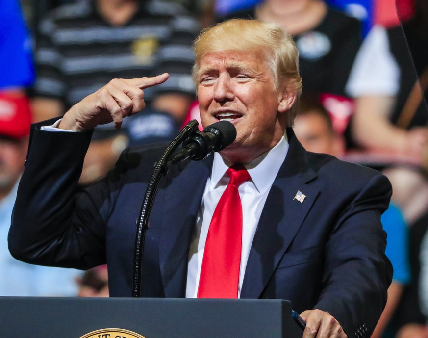 epa06042159 US President Donald J. Trump gestures as he speaks during a rally at the US Cellular Center in Cedar Rapids, Iowa, USA, 21 June 2017. Trump spoke on his idea to build a solar wall along th ...