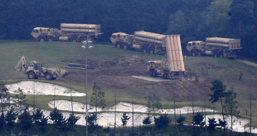 FILE - In this Sept. 7, 2017, file photo, U.S. missile defense system called Terminal High-Altitude Area Defense system, or THAAD, are seen at a golf course in Seongju, South Korea. North Korea launch ...