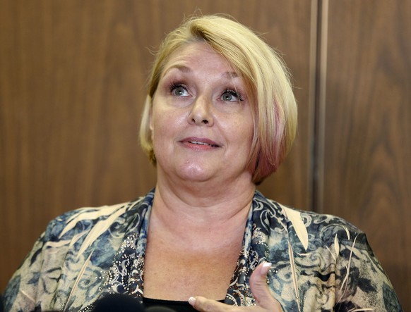 Samantha Geimer talks to the media at Los Angeles Superior Court after a motion hearing Friday, June 9, 2017. Geimer, a sex crime victim, appealed to a judge to end the case against film director Roma ...