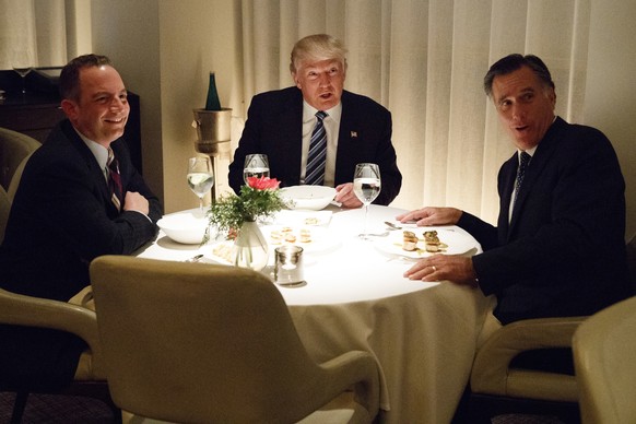President-elect Donald Trump, center, eats dinner with Mitt Romney, right, and Trump Chief of Staff Reince Priebus at Jean-Georges restaurant, Tuesday, Nov. 29, 2016, in New York. (AP Photo/Evan Vucci ...