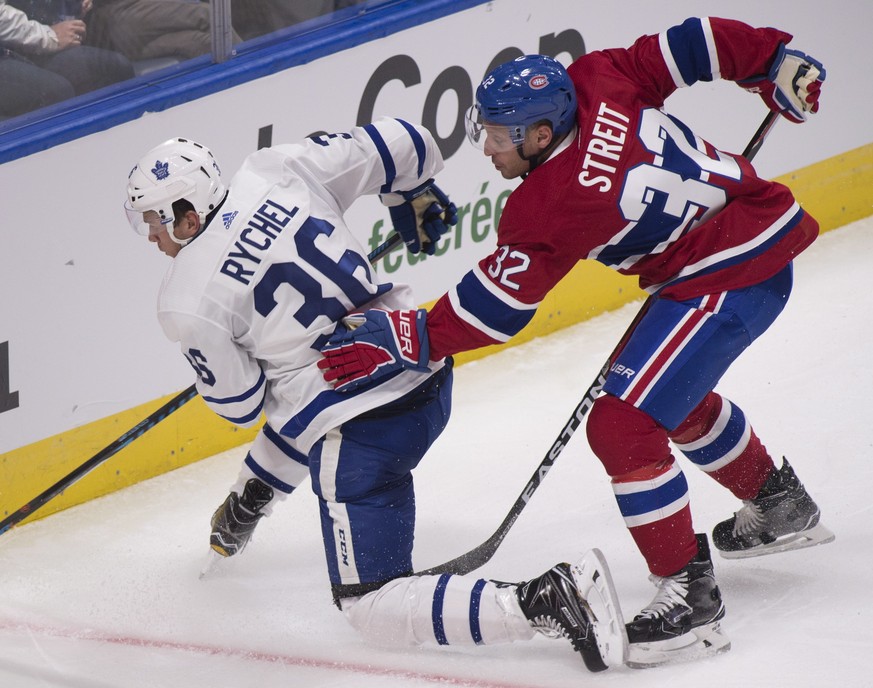 Montreal Canadiens&#039; Mark Streit, right, pushes Toronto Maple Leafs&#039; Kerby Rychel during the second period of a preseason NHL hockey game, Wednesday, Sept. 27, 2017 in Quebec City, Quebec. (J ...
