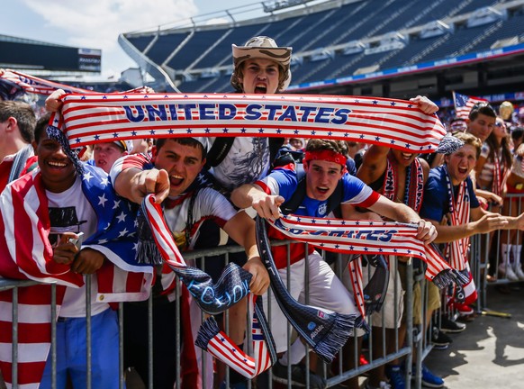 epa04294669 US fans cheer during a screening of the FIFA World Cup 2014 Round of 16 match between the USA and Belgium played at the Arena Fonte Nova in Salvador, Brazil, at Soldier Field in Chicago, I ...