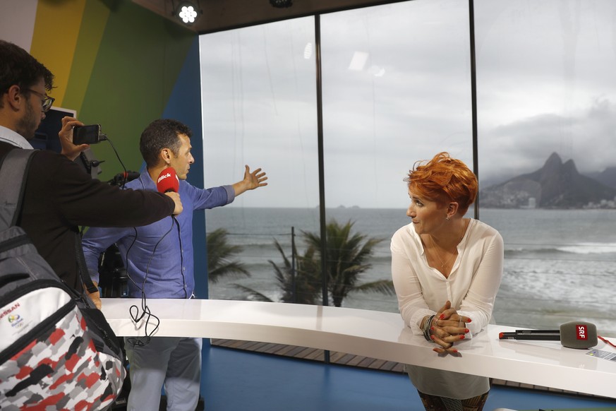 Swiss sport moderators Jann Billeter, left, and Steffi Buchli, right, are interviewed during a media tour in the SRG TV-Studio in Ipanema, in Rio de Janeiro, Brazil, prior to the Rio 2016 Olympic Summ ...