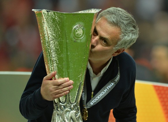 epa05987743 Manchester United manager Jose Mourinho celebrates with the trophy after winning against Ajax Amsterdam the UEFA Europa League Final match at the Friends Arena in Stockholm, Sweden, 24 May ...