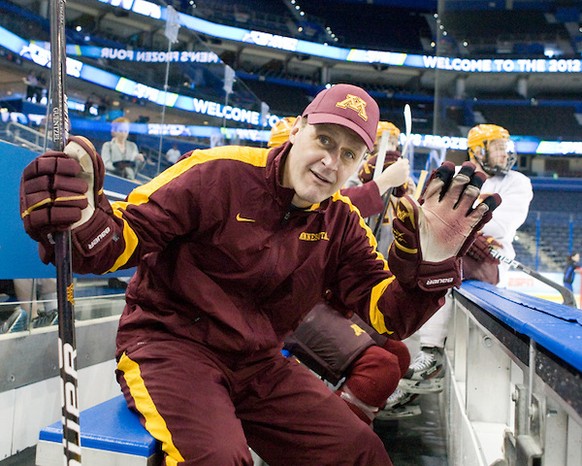 Mike Guentzel (Minnesota - Associate Head Coach) waves to the camera while waiting to take the ice. - The Minnesota Golden Gophers practiced at the Tampa Bay Times Forum on Wednesday, April 4, 2012, i ...