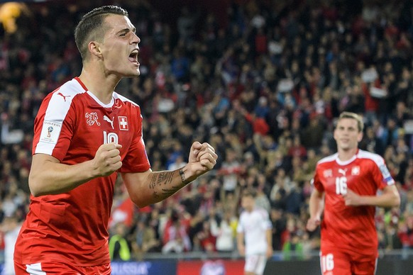 epa06250990 Switzerland&#039;s Granit Xhaka (L) celebrates scoring during the 2018 FIFA World Cup group B qualification soccer match between Switzerland and Hungary in the St. Jakob-Park stadium in Ba ...