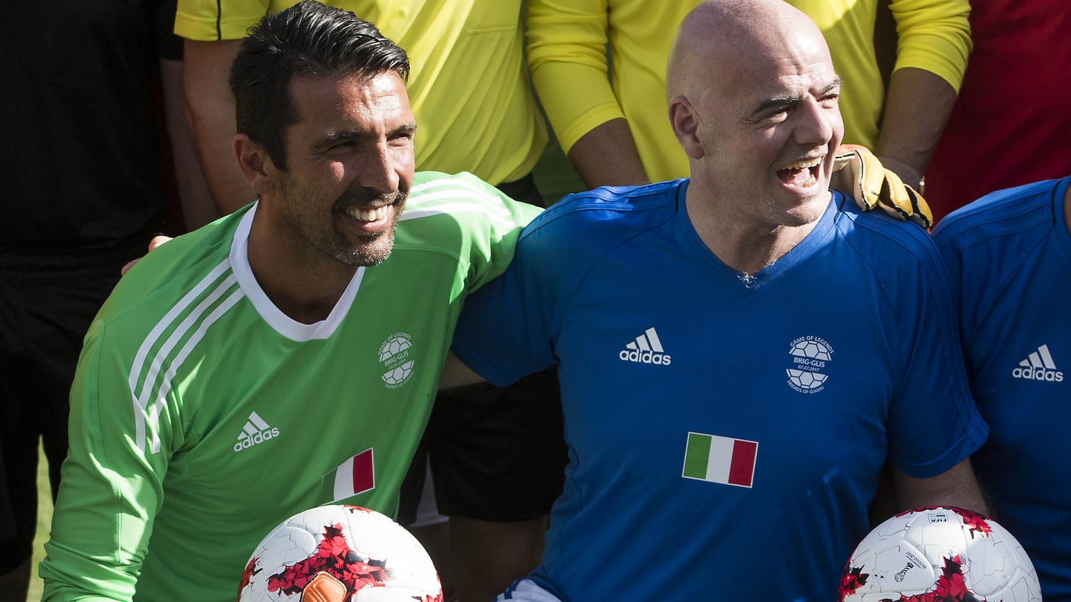 Italian goalkeeper Gianluigi Buffon, left, reacts next to FIFA President Gianni Infantino, right, during the Gianni&#039;s game a soccer match with many football legends, at the stadium Sportplatz Ges ...