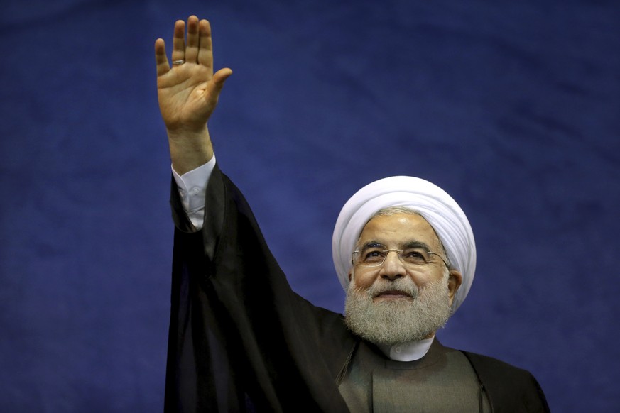 Iranian President Hassan Rouhani waves to his supporters upon arrival in a campaign rally for May 19 presidential election in Tehran, Iran, Saturday, May 13, 2017. Iran&#039;s President Hassan Rouhani ...