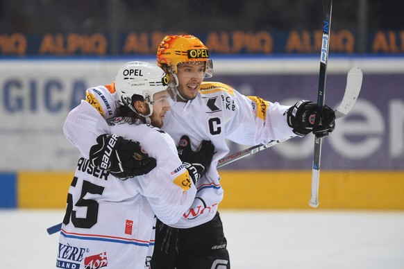 Fribourg&#039;s player Julian Sprunger, right, celebrates the 0-2 goal, during the second playout final game of National League A (NLA) Swiss Championship 2016/17 between HC Ambri Piotta and Fribourg  ...