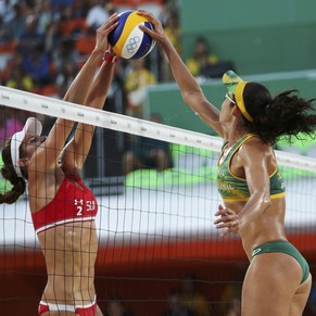 2016 Rio Olympics - Beach Volleyball - Women&#039;s Quarterfinal - Beach Volleyball Arena - Rio de Janeiro, Brazil - 14/08/2016. Joana Heidrich (SUI) of Switzerland blocks a shot by Talita (BRA) of Br ...