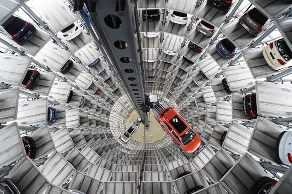 A VW Golf VII car (R) and a VW Passat are loaded in a delivery tower at the plant of German carmaker Volkswagen in Wolfsburg, March 3, 2015. REUTERS/Fabian Bimmer/File Photo GLOBAL BUSINESS WEEK AHEAD ...