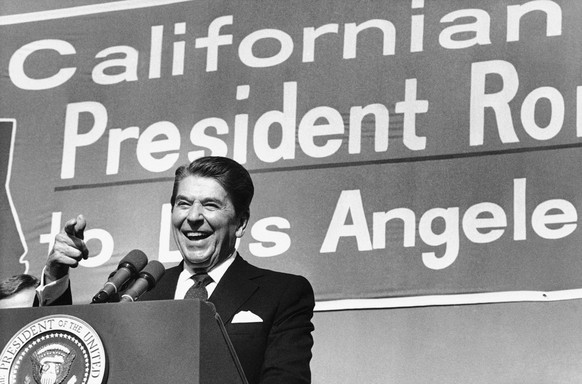 FILE - In this Monday, Nov. 5, 1984 file photo, President Ronald Reagan points toward the crowd as he speaks during a rally at Pierce College in the Woodland Hills area of Los Angeles. AP Photographer ...