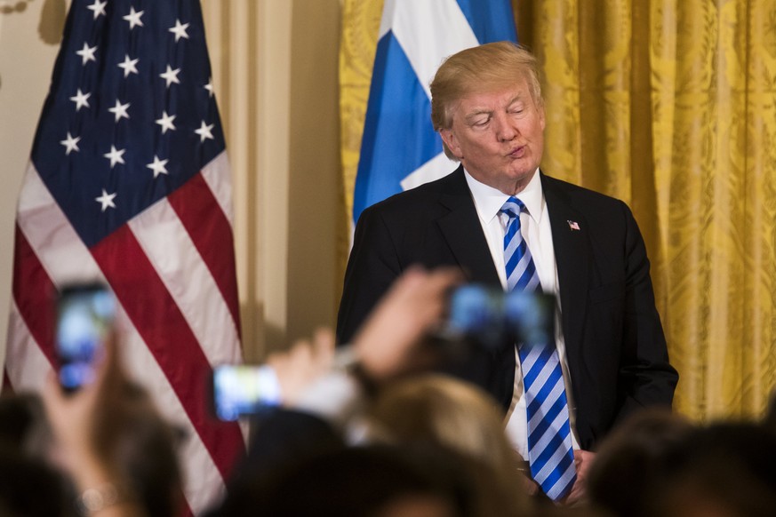epaselect epa05868454 US President Donald J. Trump attends a Greek Independence Day celebration in the East Room of the White House in Washington, DC, USA, 24 March 2017. Republican lawmakers in the H ...