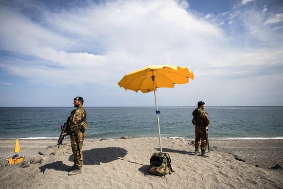 epa05989390 Italian soldiers guard in Giardini Naxos prior to the G7 summit scheduled for May 26 and 27 in Taormina, 25 May 2017. Four leaders will make their G7 premier, U.S. President Donald Trump,  ...