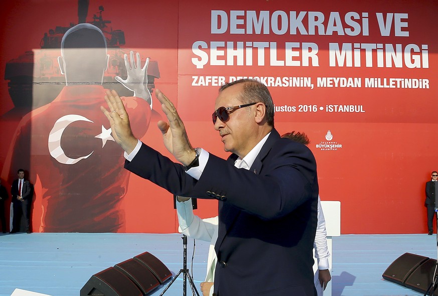 Turkey&#039;s President Tayyip Erdogan greets people during the Democracy and Martyrs Rally, organized by him and supported by ruling AK Party (AKP), oppositions Republican People&#039;s Party (CHP) a ...