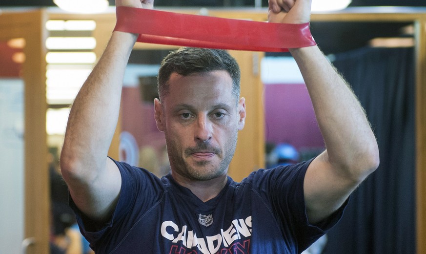 Montreal Canadiens defenseman Mark Streit, from Switzerland, stretches during medical exams on the first day of training camp Thursday in Brossard, Quebec, Thursday, Sept. 14, 2017. (Ryan Remiorz/The  ...