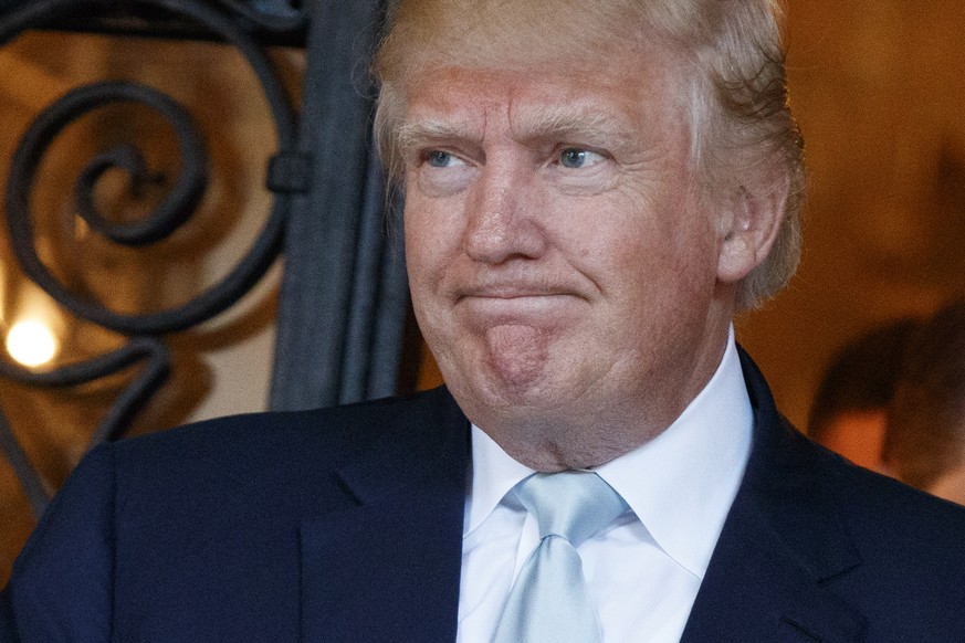 FILE - In this Dec. 28, 2016 file photo, President-elect Donald Trump talks to reporters at Mar-a-Lago in Palm Beach, Fla. (AP Photo/Evan Vucci)