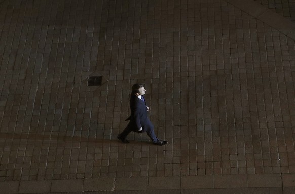 Incoming French President Emmanuel Macron walks towards the stage to address his supporters at the Louvre Palace in Paris, Sunday May 7, 2017. Polling agencies have projected that centrist Macron will ...