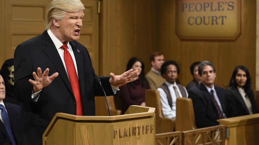 This Saturday, Feb. 11, 2017, image released by NBC shows host Alec Baldwin as President Donald Trump during the &quot;Trump People&#039;s Court&quot; in New York. In his spoof, President Trump made g ...
