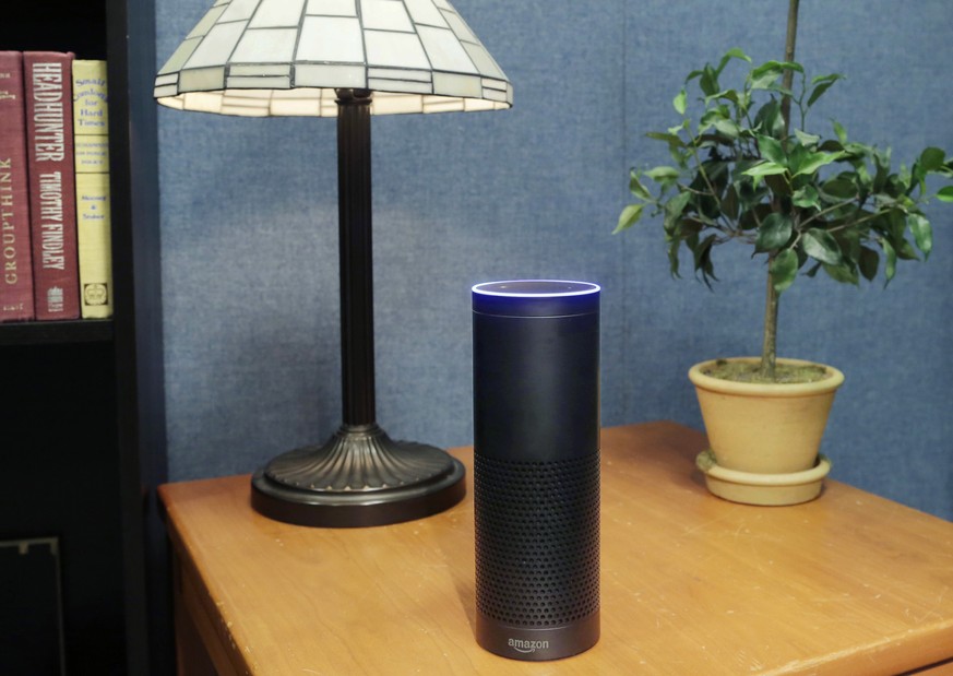 FILE - This July 29, 2015, file photo made in New York shows Amazon&#039;s Echo, a digital assistant that continually listens for commands such as for a song, a sports score or the weather. Starting T ...