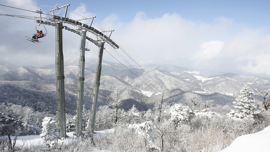 In this photo released by the Pyeongchang 2014 Olympic Winter Games Bid Committee showing a general view of alpine ski Giant Slalom and Slalom&#039;s ski slopes at Yongpyong Resort in Pyeongchang, eas ...