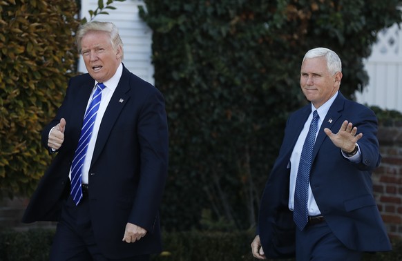 President-elect Donald Trump and Vice President-elect Mike Pence arrive at the Trump National Golf Club Bedminster clubhouse in Bedminster, N.J., Saturday, Nov. 19, 2016. (AP Photo/Carolyn Kaster)