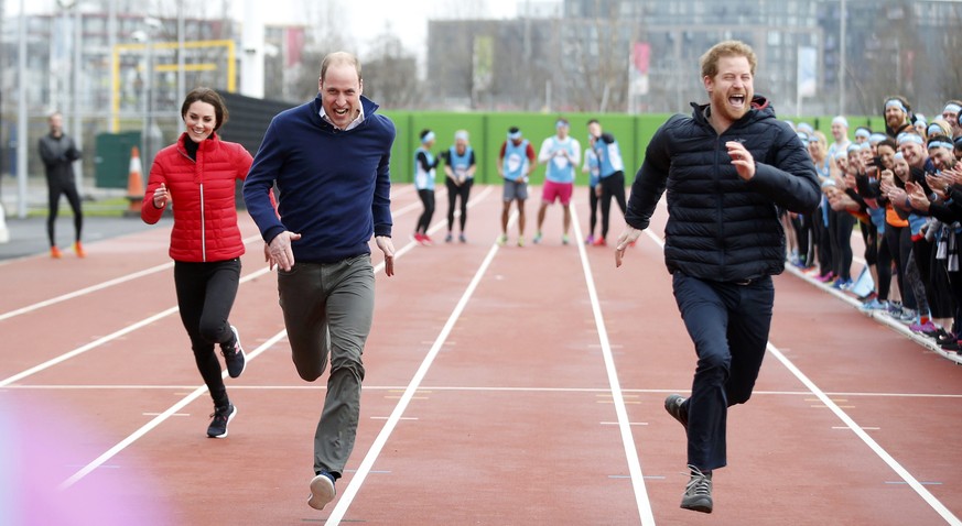 Britain&#039;s Prince William, Kate, Duchess of Cambridge, and Prince Harry take part in a relay race, during a training event to promote the charity Heads Together, at the Queen Elizabeth II Park in  ...
