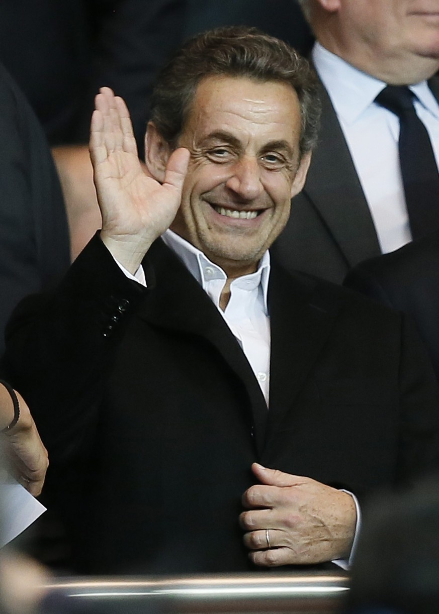 epa04293145 (FILE) A file photo dated 02 April 2014 of former French President Nicolas Sarkozy waving as he arrives to watch the UEFA Champions League quarter final first leg soccer match between Pari ...