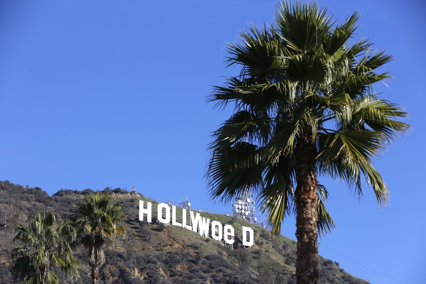 The Hollywood sign is seen vandalized Sunday, Jan. 1, 2017. Los Angeles residents awoke New Year&#039;s Day to find a prankster had altered the famed Hollywood sign to read &quot;HOLLYWeeD.&quot; Poli ...