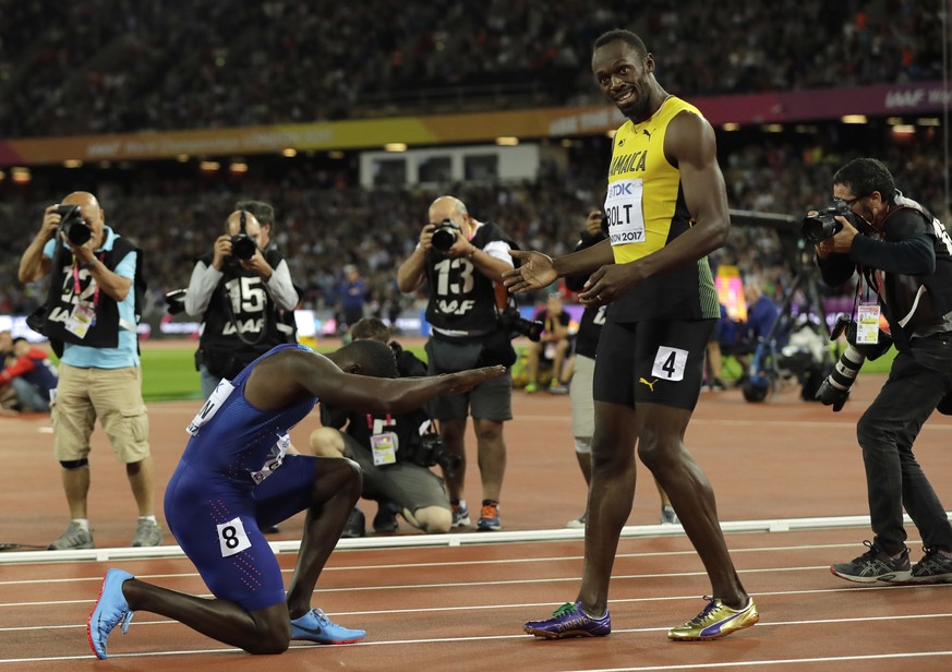 United States&#039; Justin Gatlin bows to Jamaica&#039;s Usain Bolt after winning the Men&#039;s 100 meters final during the World Athletics Championships in London Saturday, Aug. 5, 2017. (AP Photo/T ...