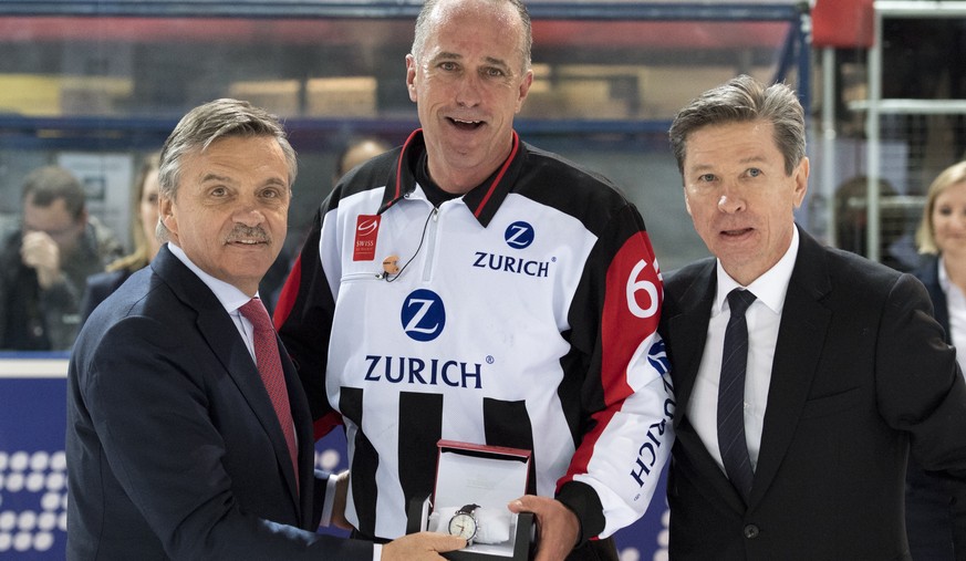 Rene Fasel, President of the International Ice Hockey Federation, IIHF, left, Danny Kurmann, referee, center, and Viatcheslav Arkadievitch &quot;Slava&quot; Bykov, former Russian ice hockey player, ta ...