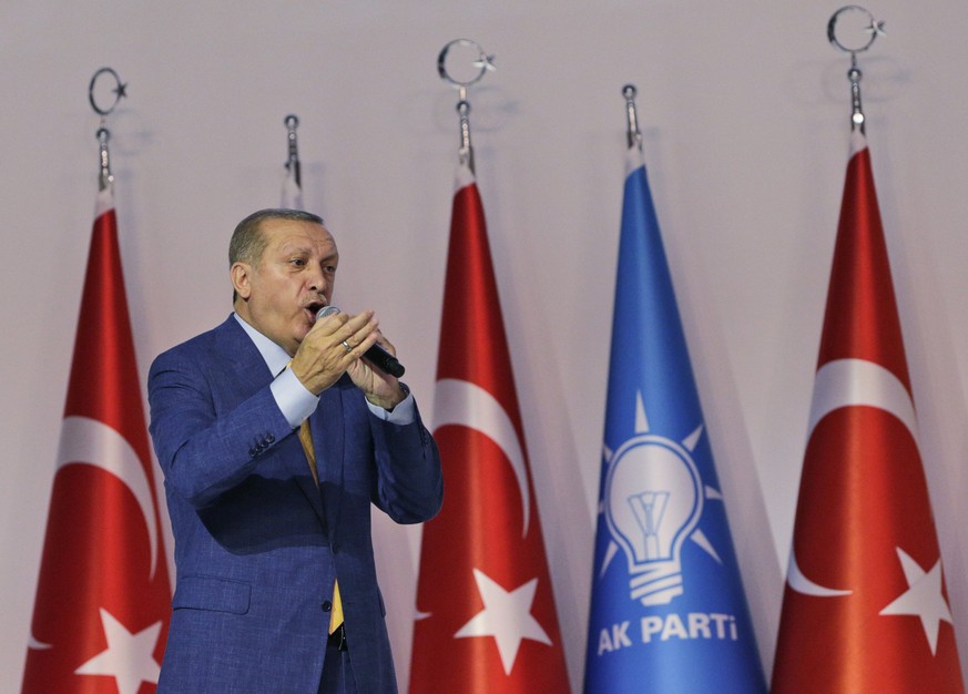 epa05978598 Turkish President Recep Tayyip Erdogan speaks during an extraordinary congress of the ruling Justice and Development Party (AKP), in Ankara, Turkey, 21 May 2017. AKP held an extraordinary  ...