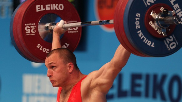epa04709033 Moldova&#039;s Anatolie Ciricu competes in the men&#039;s 94 A kg category at the European Weightlifting Championships in Tbilisi, Georgia, 17 April 2015. EPA/ZURAB KURTSIKIDZE