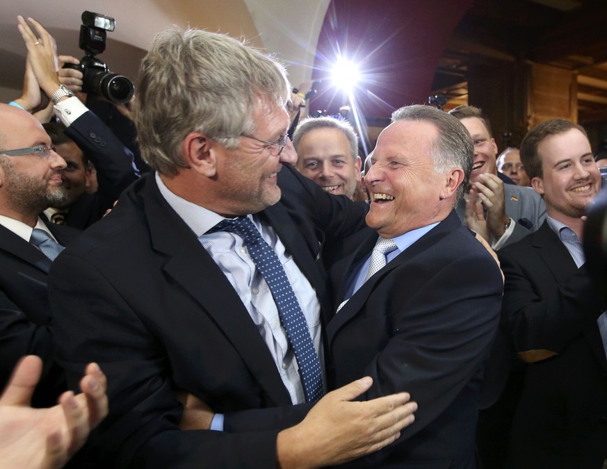 Top candidate of the anti-immigration party Alternative for Germany (AfD) Georg Pazderski and AfD co-leader Joerg Meuthen (L)react after first exit polls of the Berlin city-state elections, Germany Se ...