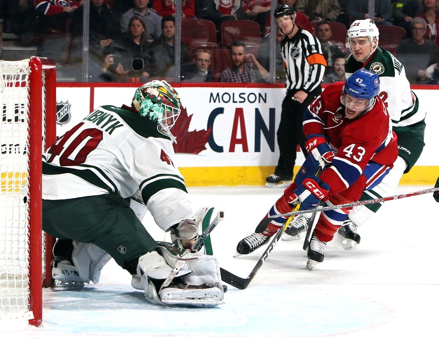 Dec 22, 2016; Montreal, Quebec, CAN; Minnesota Wild goalie Devan Dubnyk (40) makes a save against Montreal Canadiens left wing Daniel Carr (43) as right wing Nino Niederreiter (22) defends during the  ...