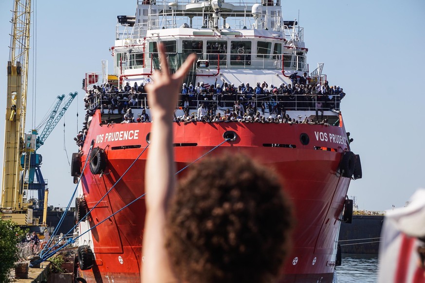 The rescue ship VOS Prudence run by the NGO Medecins Sans Frontieres (MSF) is moored at the Naples harbor, Italy, as migrants wait to be disembarked Sunday, May 28, 2017. On Thursday the VOS Prudence  ...