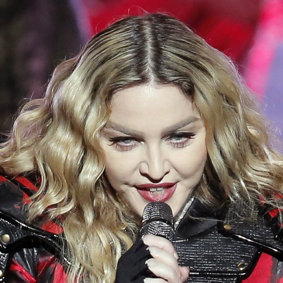 FILE - In this Feb. 20, 2016 file photo, U.S. singer Madonna performs during the Rebel Heart World Tour in Macau. Pop star Madonna has made surprise visits to Manila shelters for orphans and street ch ...