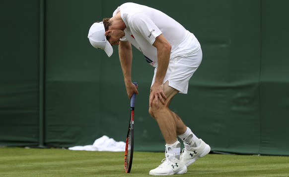 Andy Murray pauses on the practice court during a preview day at the The All England Lawn Tennis and Croquet Club, London, Saturday, July 1, 2017. (Adam Davy/PA via AP)