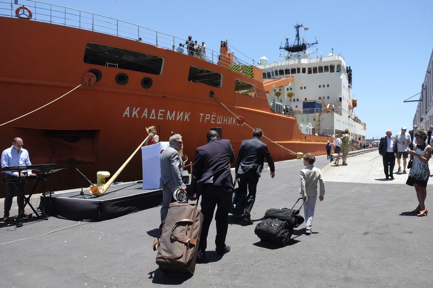 Team members arrive with luggage to board the Akademik Treshnikov, a Russian research vessel, in Cape Town, South Africa, Tuesday, Dec. 20, 2016 prior it&#039;s departure for the Antactic. It&#039;s a ...