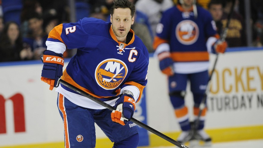 New York Islanders defenseman Mark Streit (2) skates towards a puck during practice before the NHL hockey game against the Pittsburgh Penguins on Friday, March 22, 2013 at Nassau Coliseum in Uniondale ...