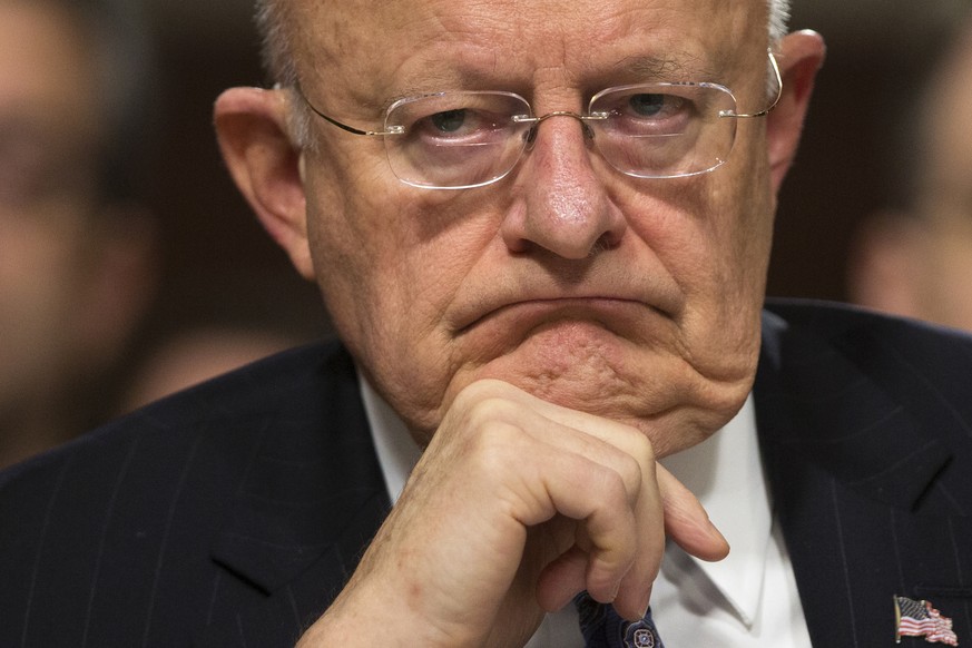 FILE - In this Feb. 9, 2016 file photo, Director of National Intelligence James Clapper listens on Capitol Hill in Washington. Clapper has resigned as DNI director. (AP Photo/Evan Vucci, File)