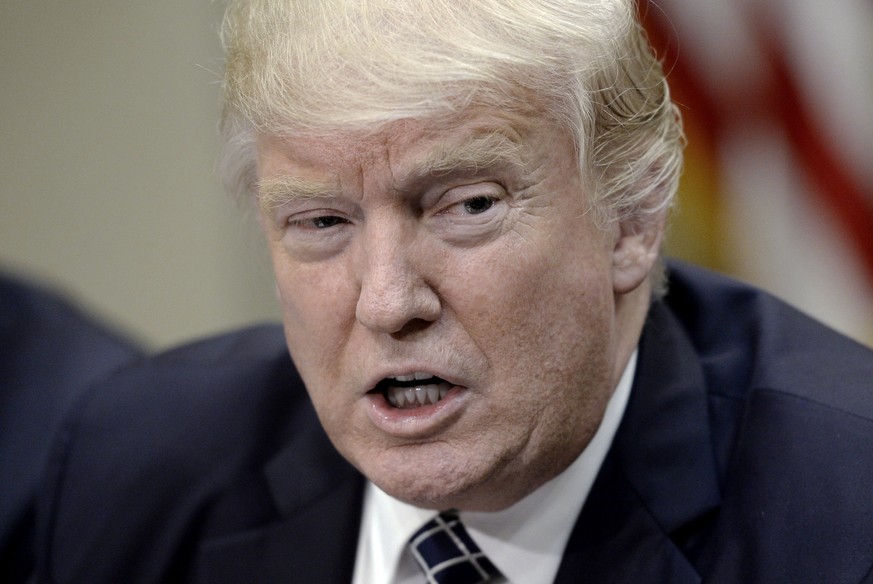 epa05927763 US President Donald J. Trump (C) speaks after signing the Executive Order Promoting Agriculture and Rural Prosperity in America during a roundtable with farmers in the Roosevelt Room of th ...