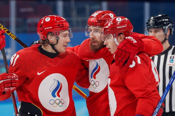 epa09760994 Nikita Nesterov (C) of Russia celebrates with teammates after scoring during the Men&#039;s Ice Hockey Play-offs Quarterfinals match between the Russian Olympic Committee and Denmark at th ...